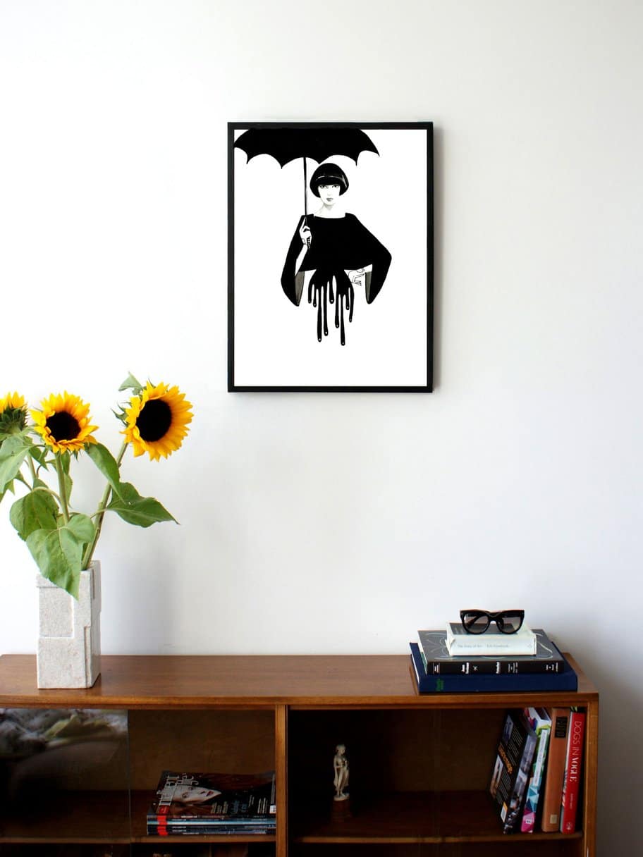 black and white illustration of a woman holding an umbrella and dripping below the waist hanging on a wall in the living room