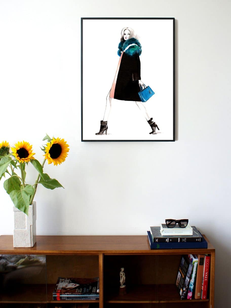 illustration of a woman walking seen from the side wearing a blue fluffy scarf and blue bag hanging on the wall in the living room