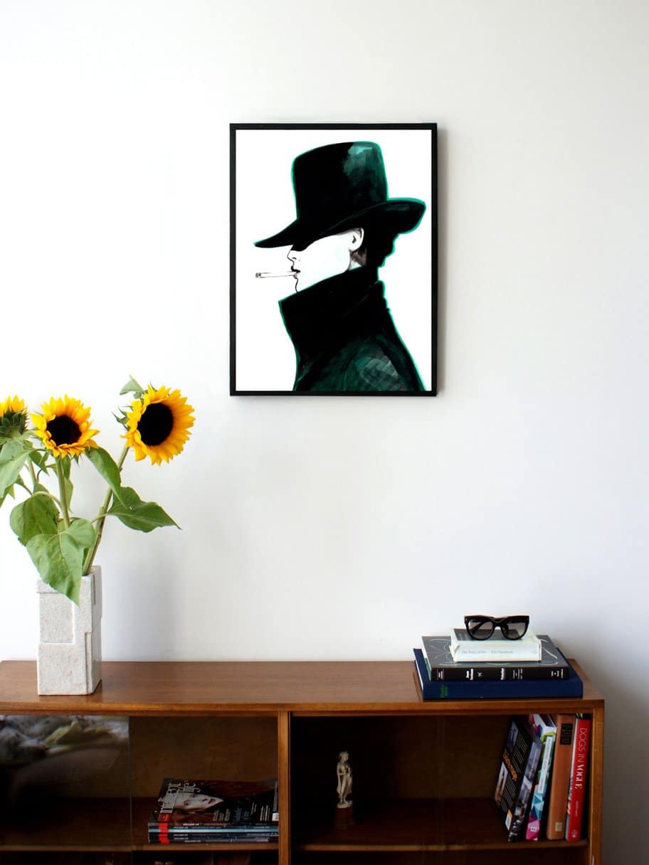 side profile illustration of a woman with a hat and coat that covers most of her face smoking a cigarette hanging on a wall in the living room