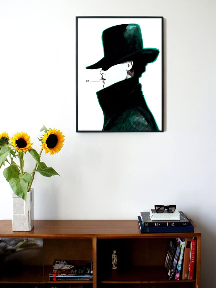 side profile illustration of a woman with a hat and coat that covers most of her face smoking a cigarette hanging on a wall in the living room