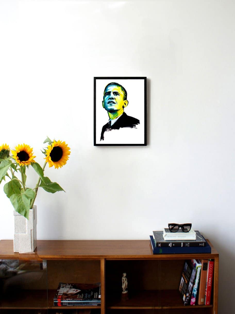 art portrait of president Obama with colored face hanging on the wall in the living room