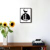 black and white illustration of a woman smoking and a pearl necklace hanging on the wall in the living room