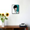 illustration of a woman with short dark hair and blue details hanging on a wall in the living room