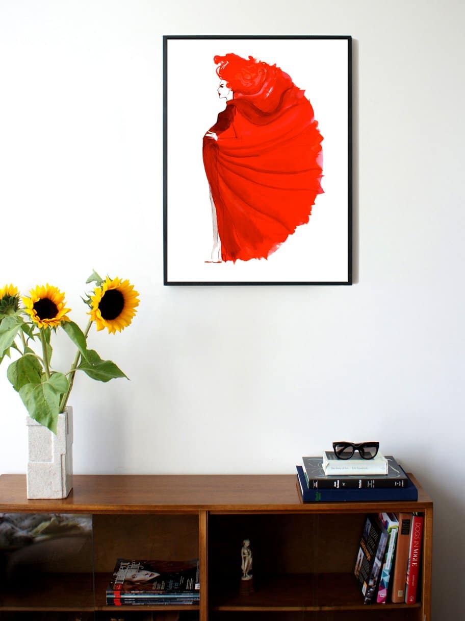illustration of a woman with a red dress and hair posing hanging on a wall in the living room