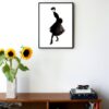 illustration in black and white of a woman posing in a skirt hanging on a wall in the living room