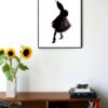 illustration in black and white of a woman posing in a skirt hanging on a wall in the living room